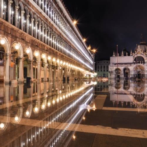 San Marco square with reflection on water at night, Venice